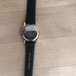 Women’s classic Movado gold tone face w black leather strap used
